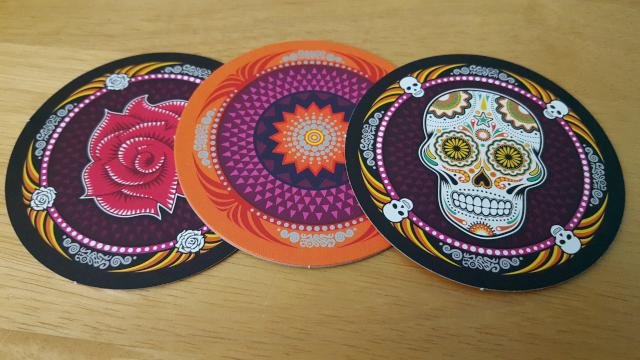 Each set of cards has three designs: flower, skull, and the pattern on the back...